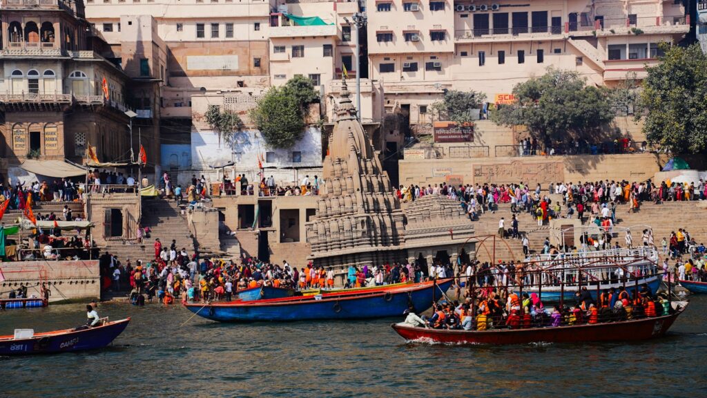 A group of boats floating on top of a body of water