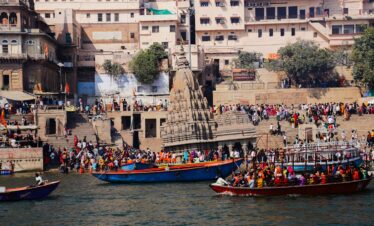 A group of boats floating on top of a body of water