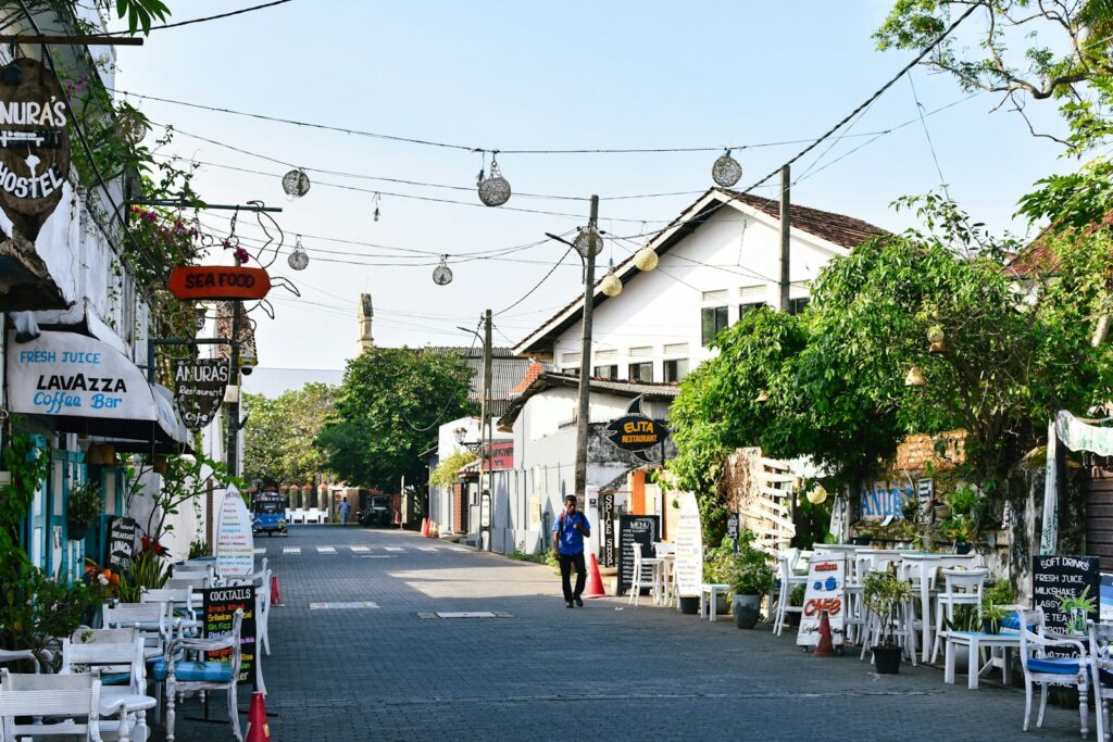 Current image: A quaint street lined with shops and restaurants.