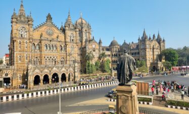 a large building with a statue in front of it