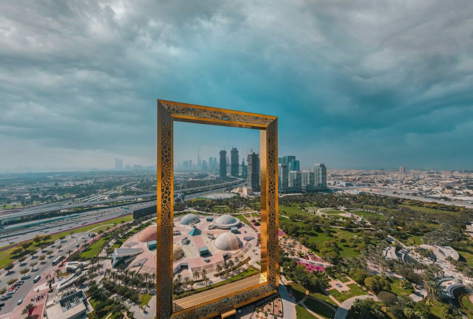 brown wooden framed mirror on top of a building