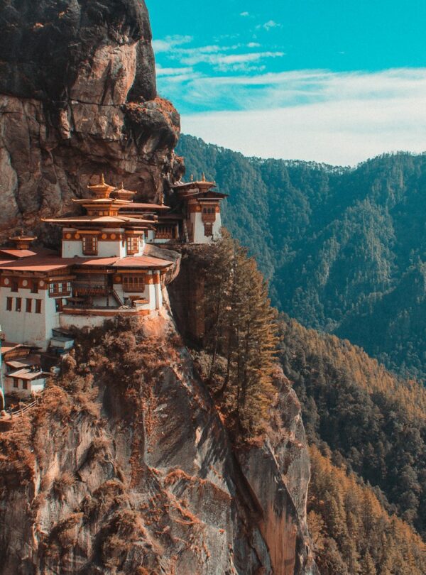 Paro Taktsang temple in Bhutan viewing mountain under blue and white sky